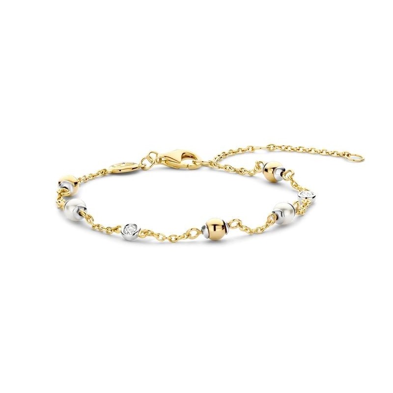 Bracelet en argent,or et perles d'imitation. Bracelet en argent,or et perles d'imitation.